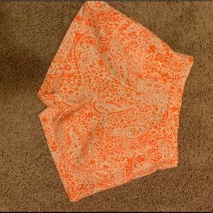 Coral and cream colored linen shorts